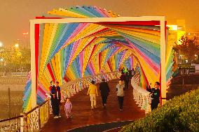 Tourists Play at Rainbow Bridge in Qingdao