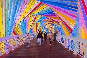 Tourists Play at Rainbow Bridge in Qingdao