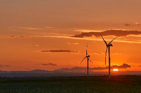 Large Wind Turbines At Sunset In The Apulian Countryside