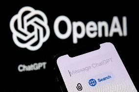 IPhone With ChatGPT “Search” Feature And OpenAI Logo In The Background