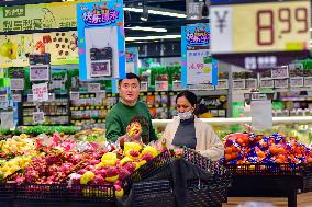 Consumers shop at a supermarket in Qingzhou