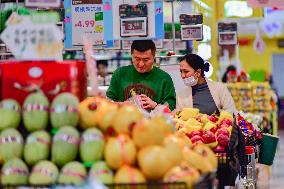 Consumers shop at a supermarket in Qingzhou