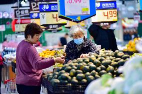 Consumers shop at a supermarket in Qingzhou