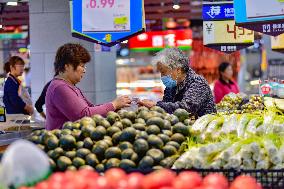 Consumers shop at a supermarket in Qingzhou