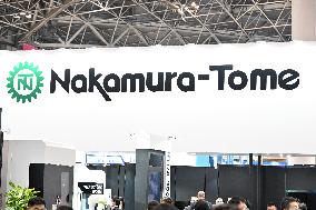 Nakamura-Tome Precision Industry signboard, logo