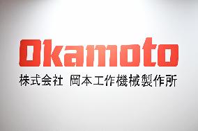 Okamoto Machine Tool Works signboards and logos