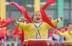 Kindergarten Children Practice Drumming