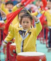 Kindergarten Children Practice Drumming