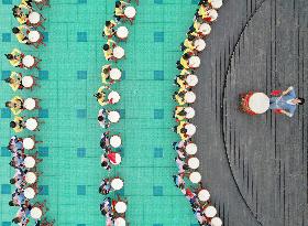 Kindergarten Children Practice Drumming