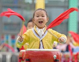 Kindergarten Children Practice Drumming