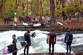 Surfers Brave The Icy Waters Of The Eisbach Stream In Munich In Autumn