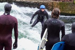 Surfers Brave The Icy Waters Of The Eisbach Stream In Munich In Autumn