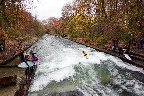 Surfers Brave The Icy Waters Of The Eisbach Stream In Munich In Autumn