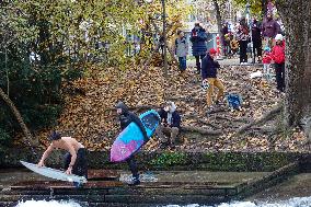 Surfers Brave The Icy Waters Of The Eisbach Stream In Munich In Autumn