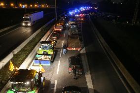 French Farmers Gather On The RN118 Road Southwestern Paris