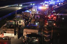 French Farmers Gather On The RN118 Road Southwestern Paris