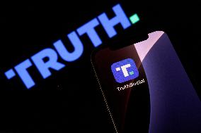 Truth Social App Displayed On IPhone With Logo In Background