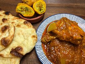 Chicken Karahi Served With Naan And Hot Chili Pakoras