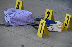 Evidence Markers Placed Where Knives Were Recovered After Stabbings Left Two People Dead And One Person Critically Wounded In Ne