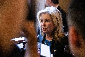 Senators Walk Past Reporters In Capitol - Washington