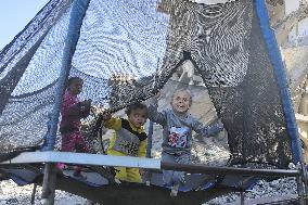 Children Entertain Amid Ruins - Gaza