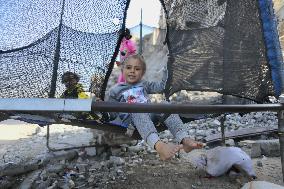 Children Entertain Amid Ruins - Gaza