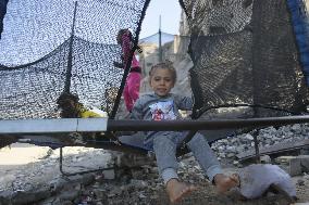 Children Entertain Amid Ruins - Gaza