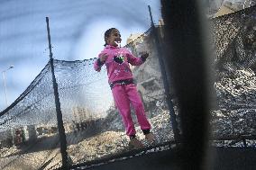 Children Entertain Amid Ruins - Gaza