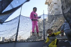 Children Entertain Amid Ruins - Gaza