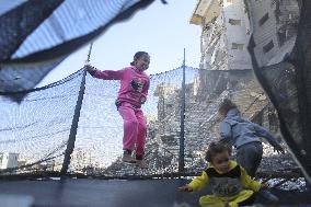 Children Entertain Amid Ruins - Gaza