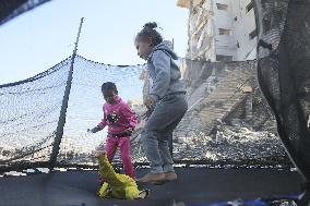 Children Entertain Amid Ruins - Gaza