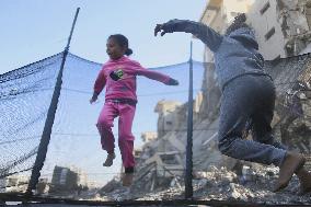 Children Entertain Amid Ruins - Gaza