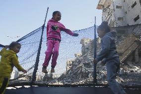 Children Entertain Amid Ruins - Gaza