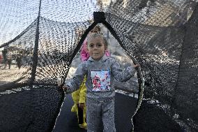 Children Entertain Amid Ruins - Gaza