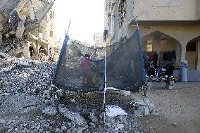 Children Entertain Amid Ruins - Gaza