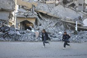 Children Entertain Amid Ruins - Gaza