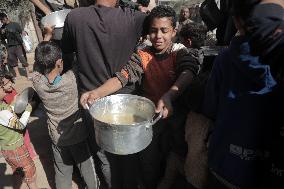 Palestinians Receive Free Food - Gaza