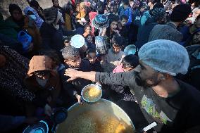 Gaza Children Wait To Receive A Hot Meal Of Food