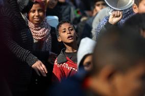 Gaza Children Wait To Receive A Hot Meal Of Food