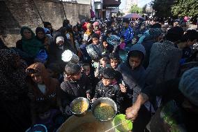 Gaza Children Wait To Receive A Hot Meal Of Food