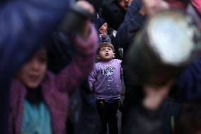 Gaza Children Wait To Receive A Hot Meal Of Food