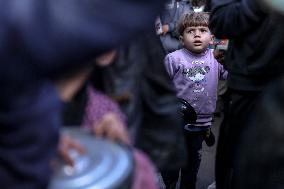 Gaza Children Wait To Receive A Hot Meal Of Food