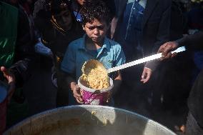 Gaza Children Wait To Receive A Hot Meal Of Food