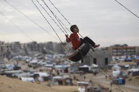 Children Entertain On A Swing - Khan Younis