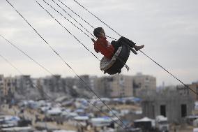 Children Entertain On A Swing - Khan Younis