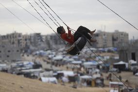 Children Entertain On A Swing - Khan Younis