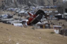 Children Entertain On A Swing - Khan Younis