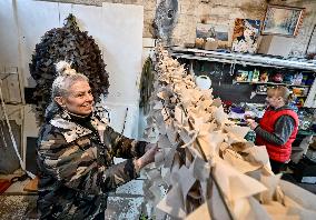 Volunteers weave winter camouflage nets for army in Zaporizhzhia