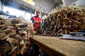 Volunteers weave winter camouflage nets for army in Zaporizhzhia