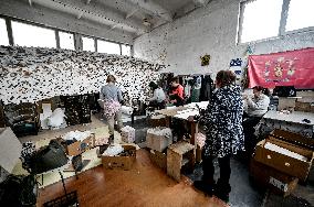 Volunteers weave winter camouflage nets for army in Zaporizhzhia